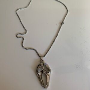 Silvertone ghost face mask necklace. Halloween. Goth.